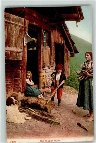 Mutter mit ihren Kindern und Hund beim Holzen