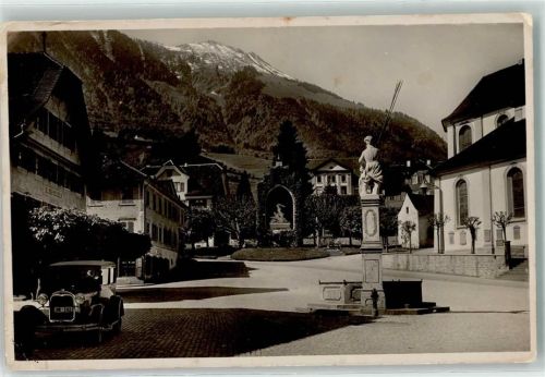 6370 Stans Foto AK Dorfplatz Winkelried Denkmal Oldtimer