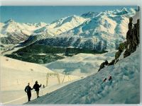 Celerina/Schlarigna Skilift Saluver Blick auf Pontresina und Berninagruppe Winter Skifahrer