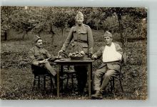Cornol Drei Soldaten in Uniform an einem Tisch im Garten Ort lt. Fotograf Straehl Militär Schweiz Foto AK