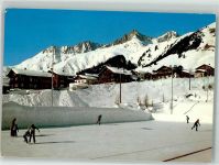 7188 Sedrun Winter Eisplatz mit Crispalt Piz Nair