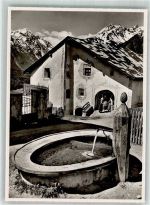 7545 Guarda Foto AK Dorfpartie Dorfbrunnen