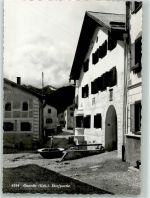 7545 Guarda Foto AK Dorfpartie Brunnen