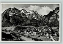 8754 Netstal 1952 Foto AK mit Bahnhif, Glärnischkette