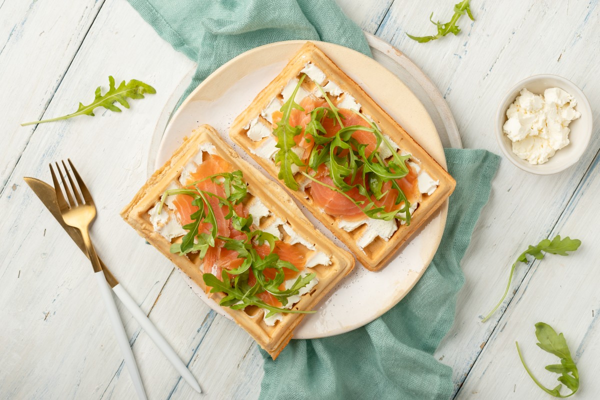 Waffles with salmon, cream cheese and rocket