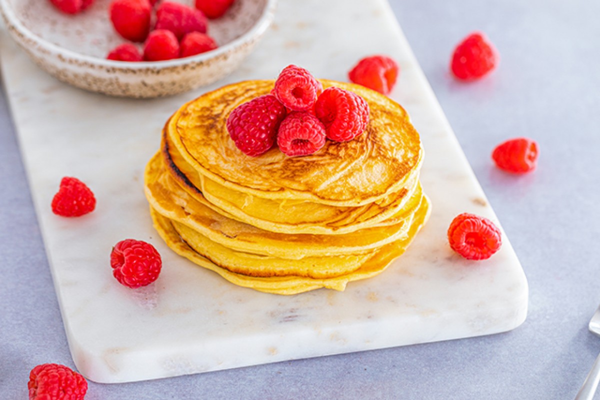 Fluffy curd cheese pancakes with raspberries