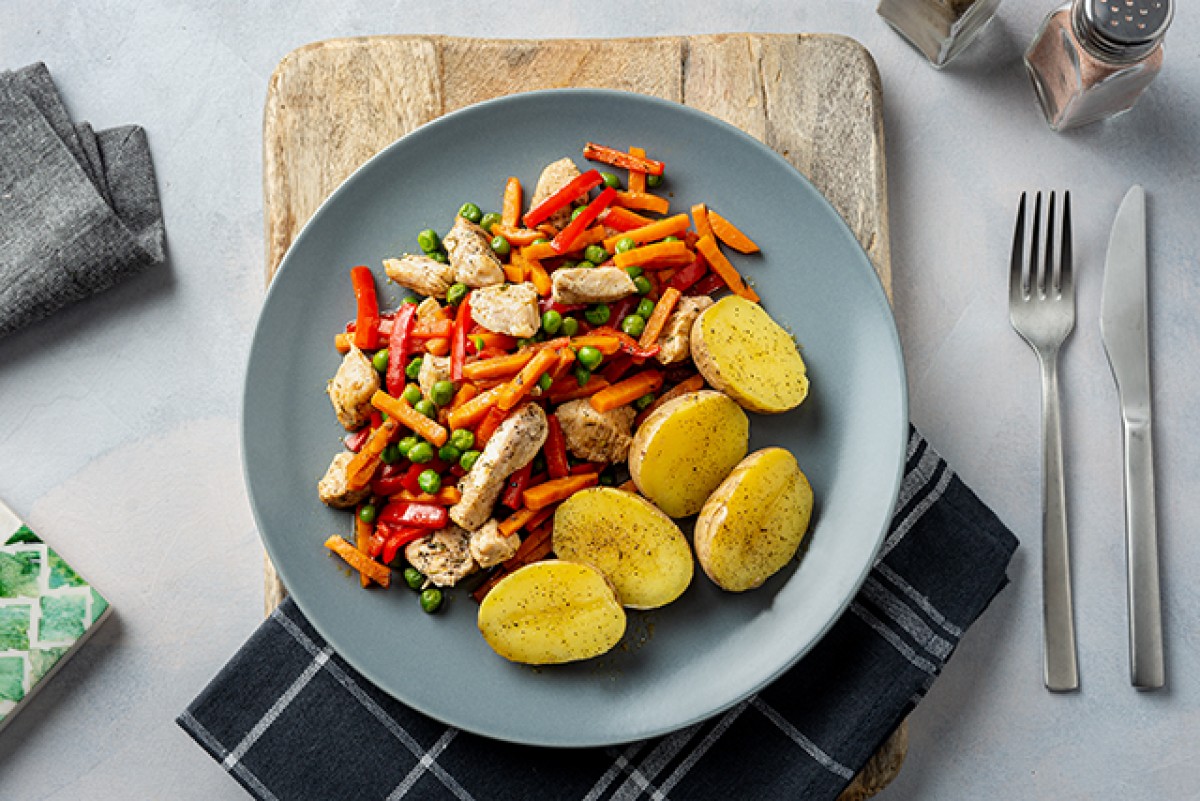 Stewed chicken with peas, carrots and potatoes