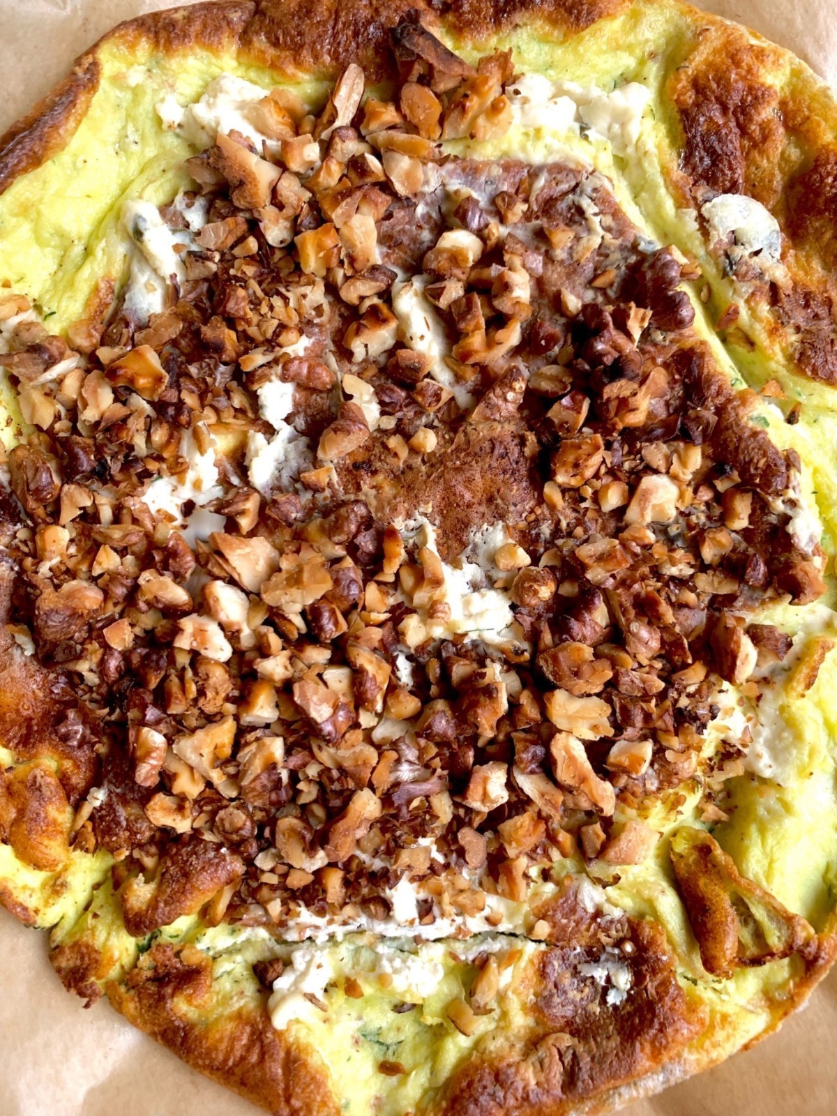 Omelette à la fromage with garlic, dill and nuts