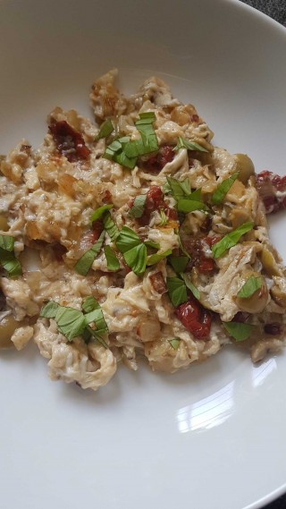 Scrambled eggs with olives and sun-dried tomatoes