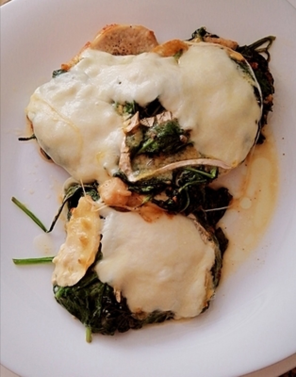 Pork loins topped with spinach