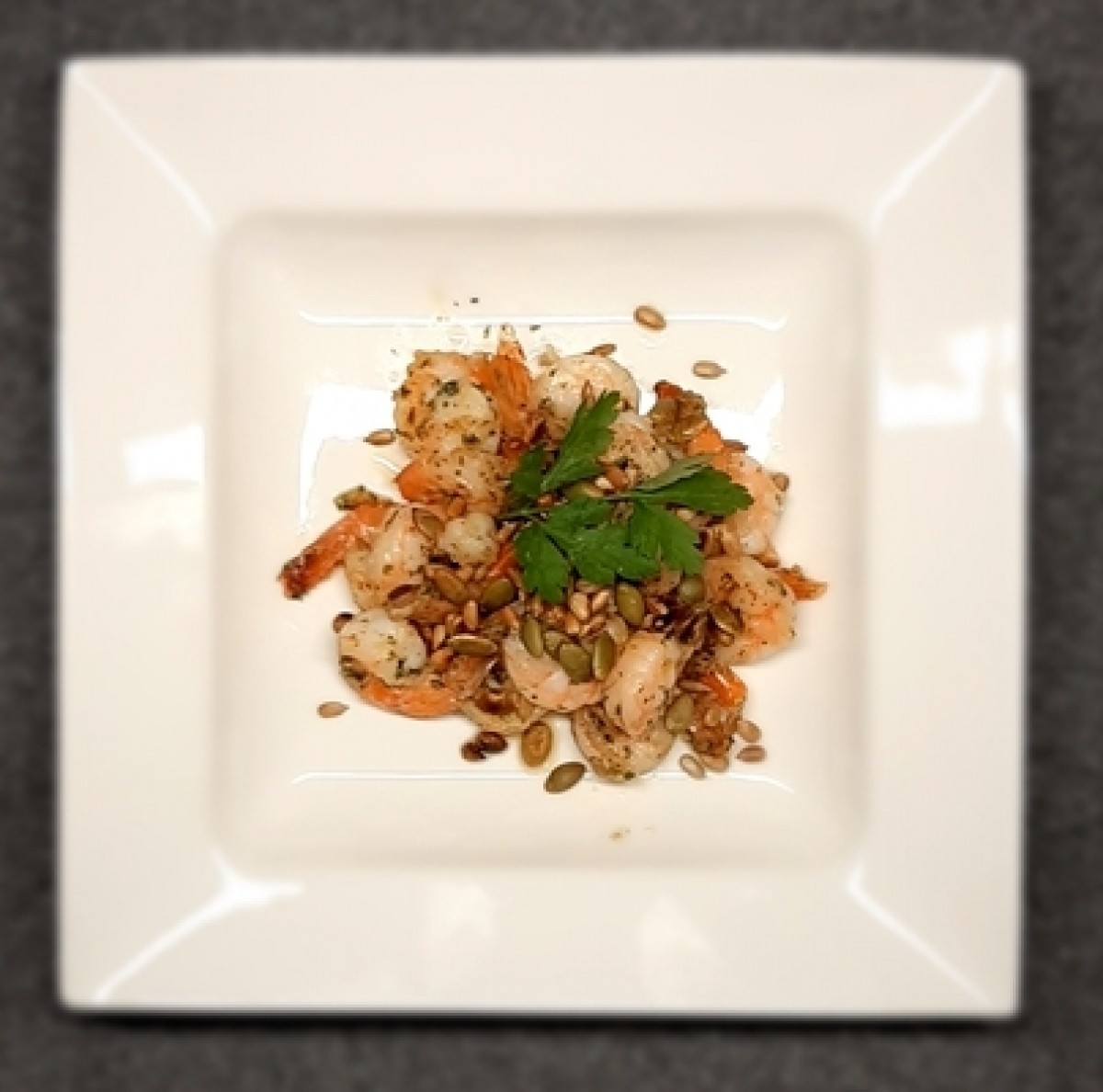 Shrimps in butter with garlic and sunflower seeds