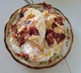 Fried eggs on bacon