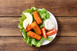 Fish fingers in batter with lettuce and tomato salad
