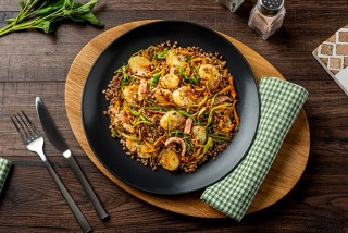 Fried buckwheat groats with ham and potatoes