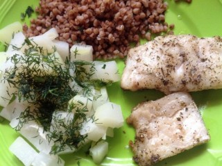 Oven-baked fish with groats and stewed kohlrabi