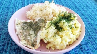 Baked fish with mashed potatoes and pickled cabbage