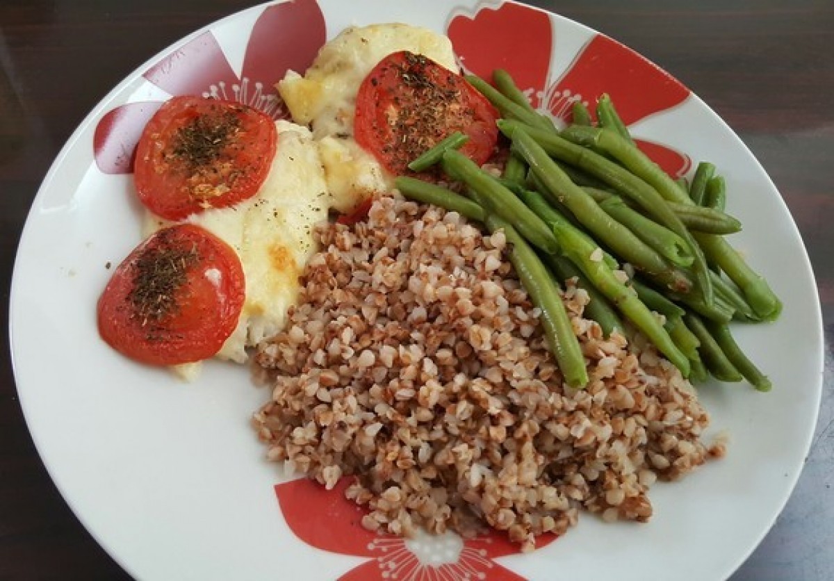 Baked fish with mozzarella and tomatoes, with groats and beans
