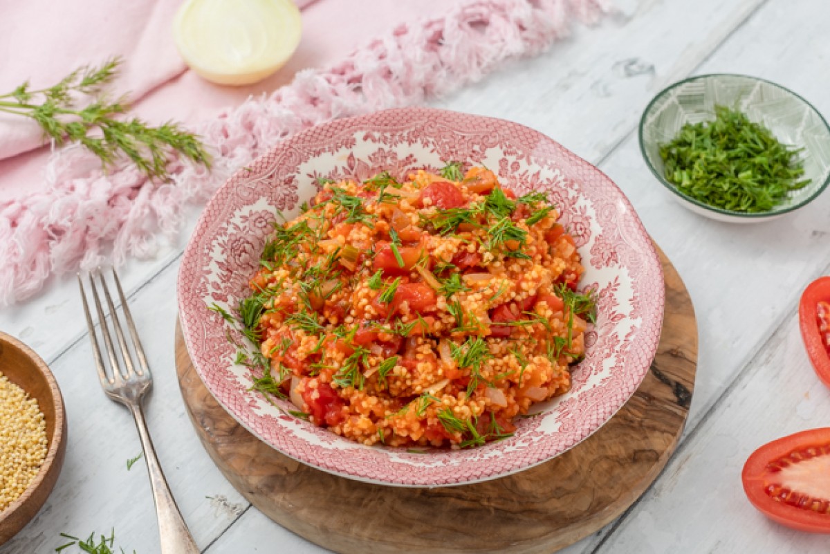 Millet groats with tomatoes and dill