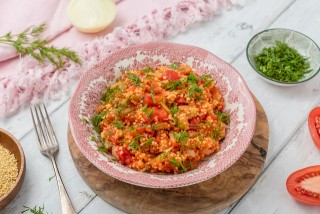 Millet groats with tomatoes and dill