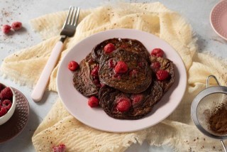 Chocolate pancakes with raspberries