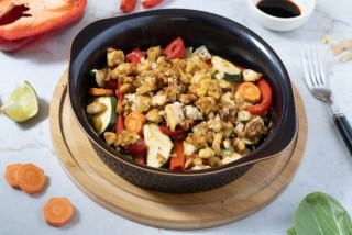 Roasted vegetables in teriyaki sauce with crispy tofu