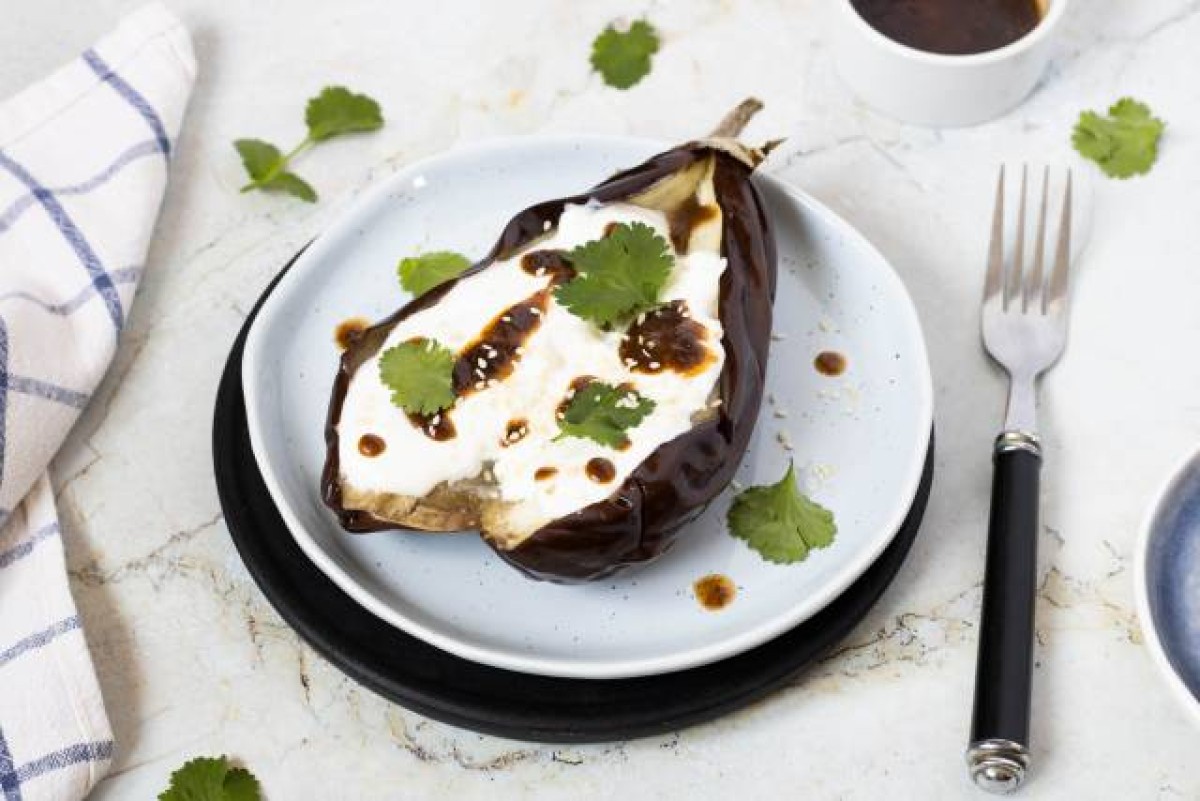 Baked aubergine with yoghurt and harissa