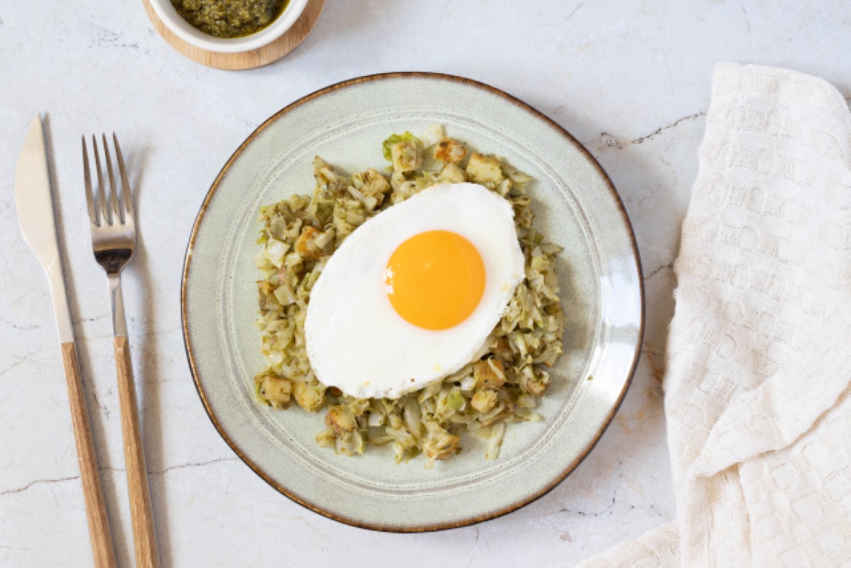 Cabbage with halloumi, pesto, and fried egg