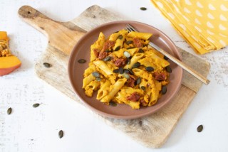 Pasta in a creamy pumpkin sauce with sun-dried tomatoes