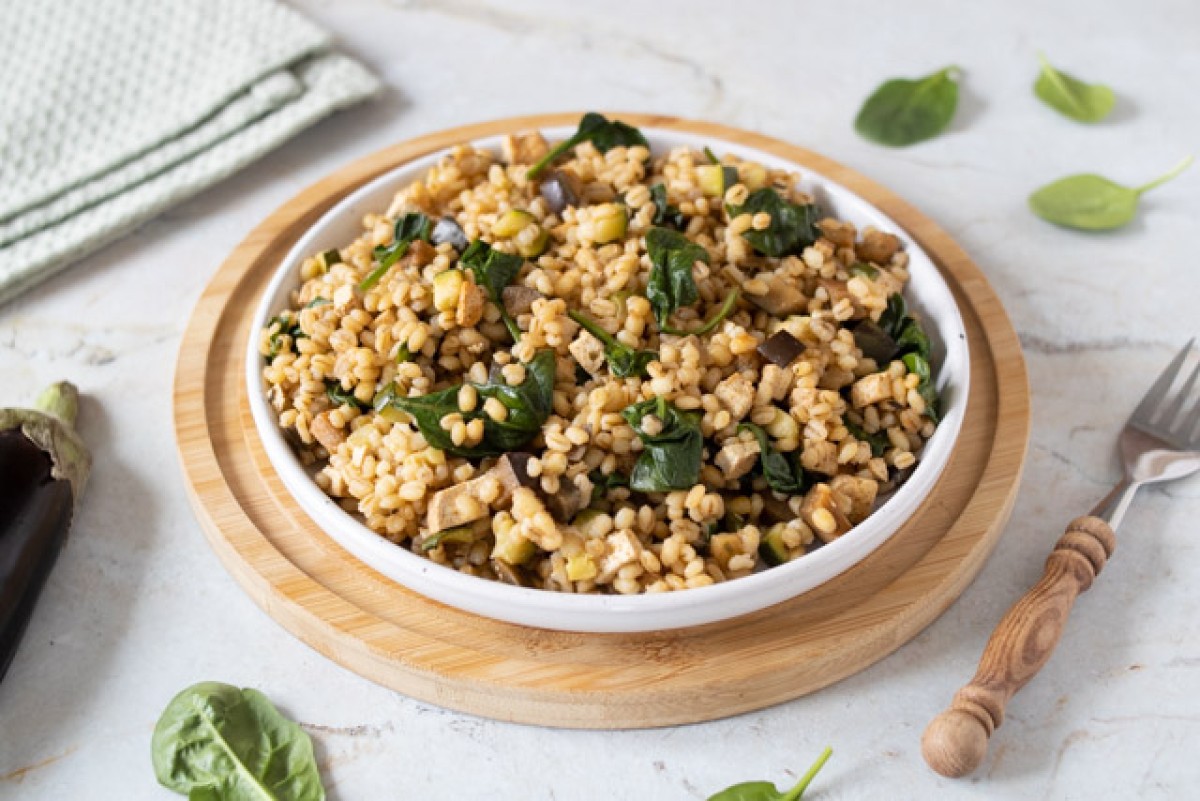 Pearl barley risotto with zucchini and eggplant on vegetable broth