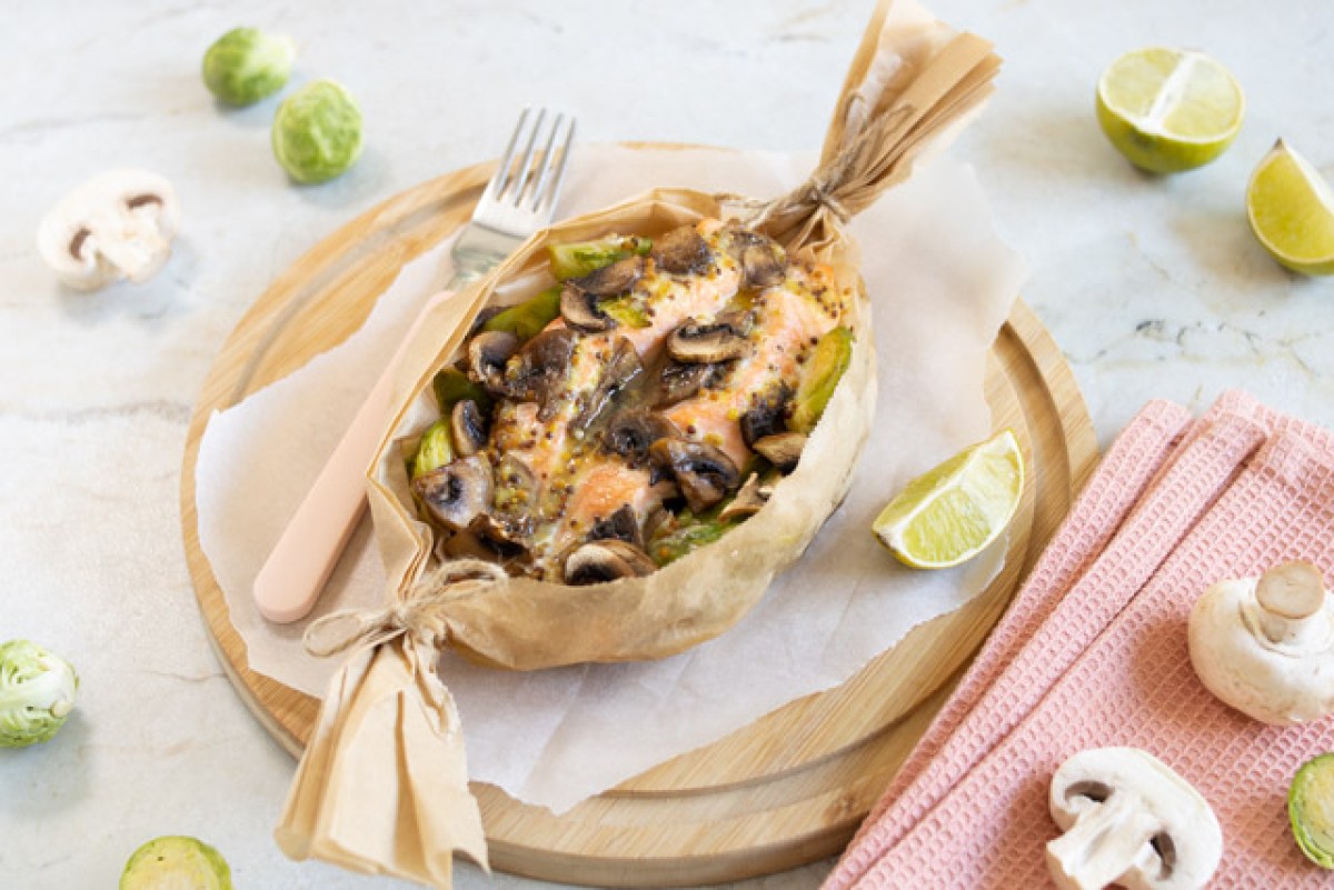 Baked salmon in parchment with brussels sprouts and mushrooms