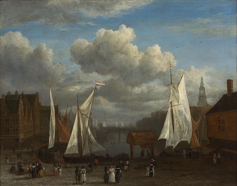 Gezicht op het Damrak met op de voorgrond de Dam te Amsterdam