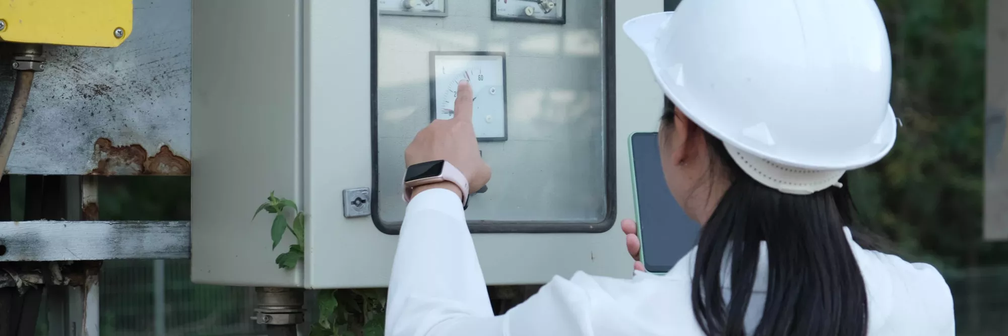 electrician-checking-analog-voltmeter-with-dial-and-arrow-engineer-inspects-the-fire-control-panel-to-manage-the-factory-outside-video
