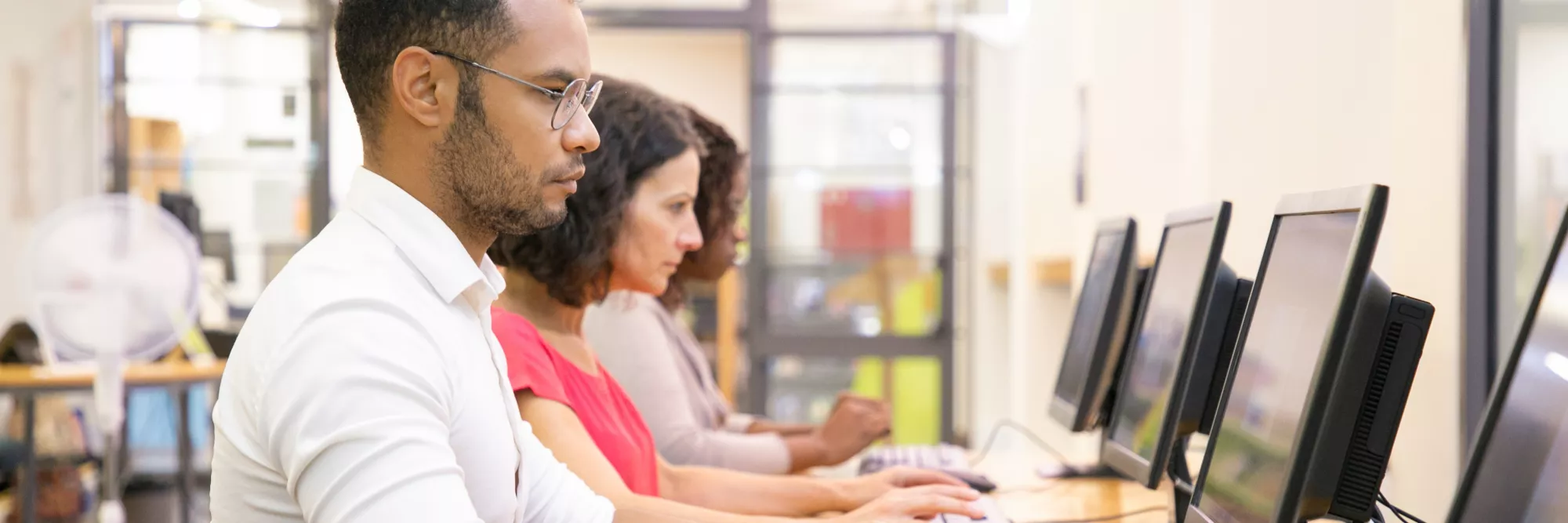 diverse-group-students-taking-online-tests