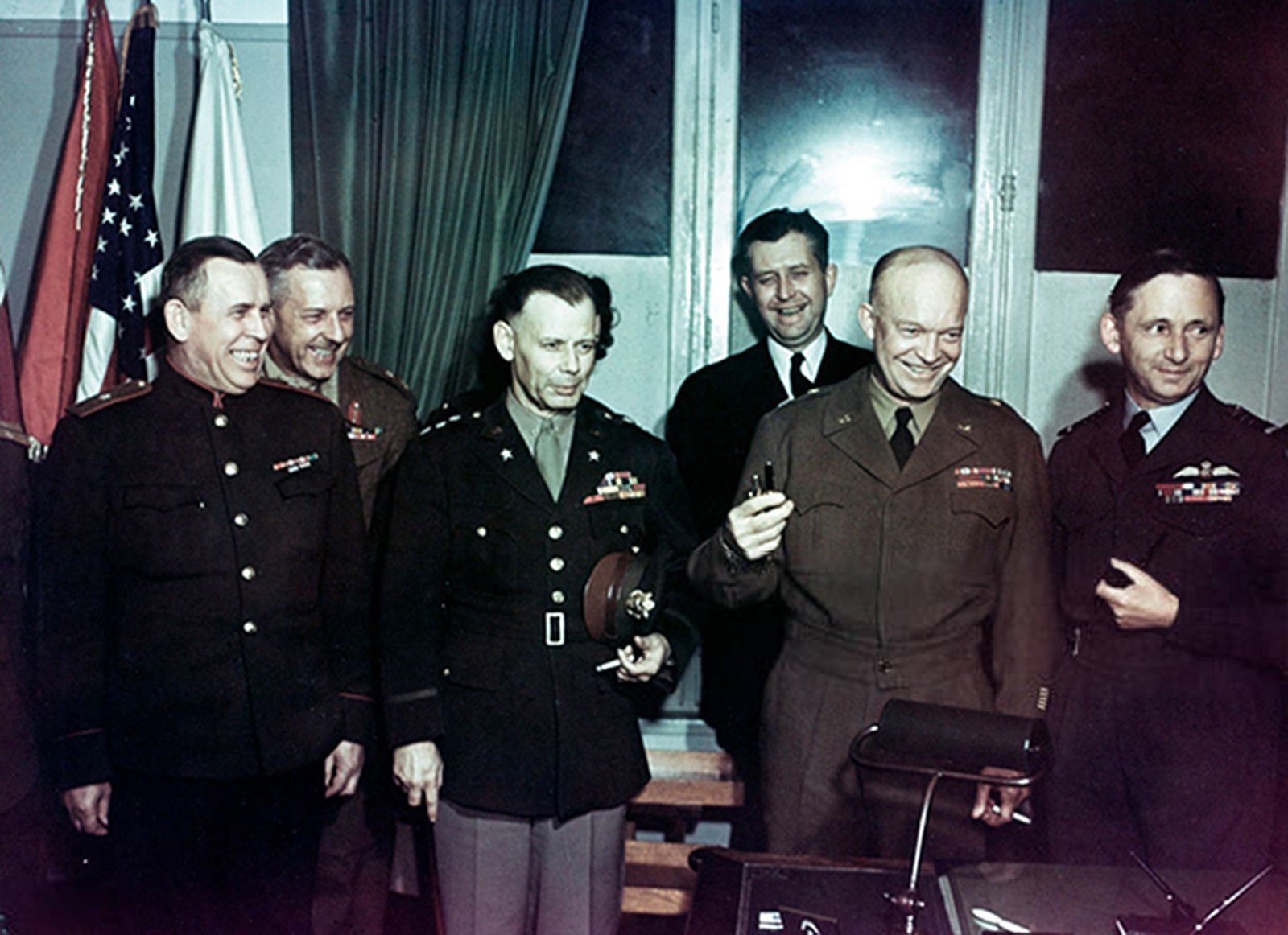 Military-Industrial Complex, A celebration of Germany’s unconditional surrender in WWII, Reims, France, May 7, 1945, featuring the senior military leadership of the Allies (Soviet Union, Britain, U.S.): Eisenhower is second from the right. Source: U.S. Army, Wikipedia Commons (public domain), StudySmarter.