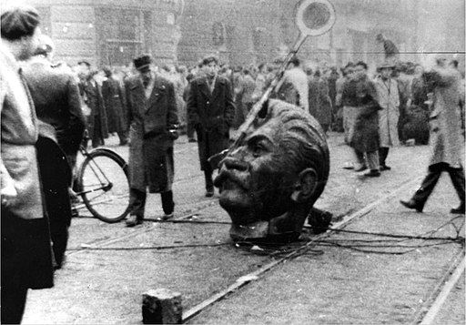 Cold War in Europe The destroyed statue of Stalin in Budapest StudySmarter