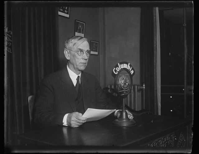 Smoot-Hawley Tariff Senator Reed Smoot explaining the Smoot-Hawley Tariff over radio StudySmarter