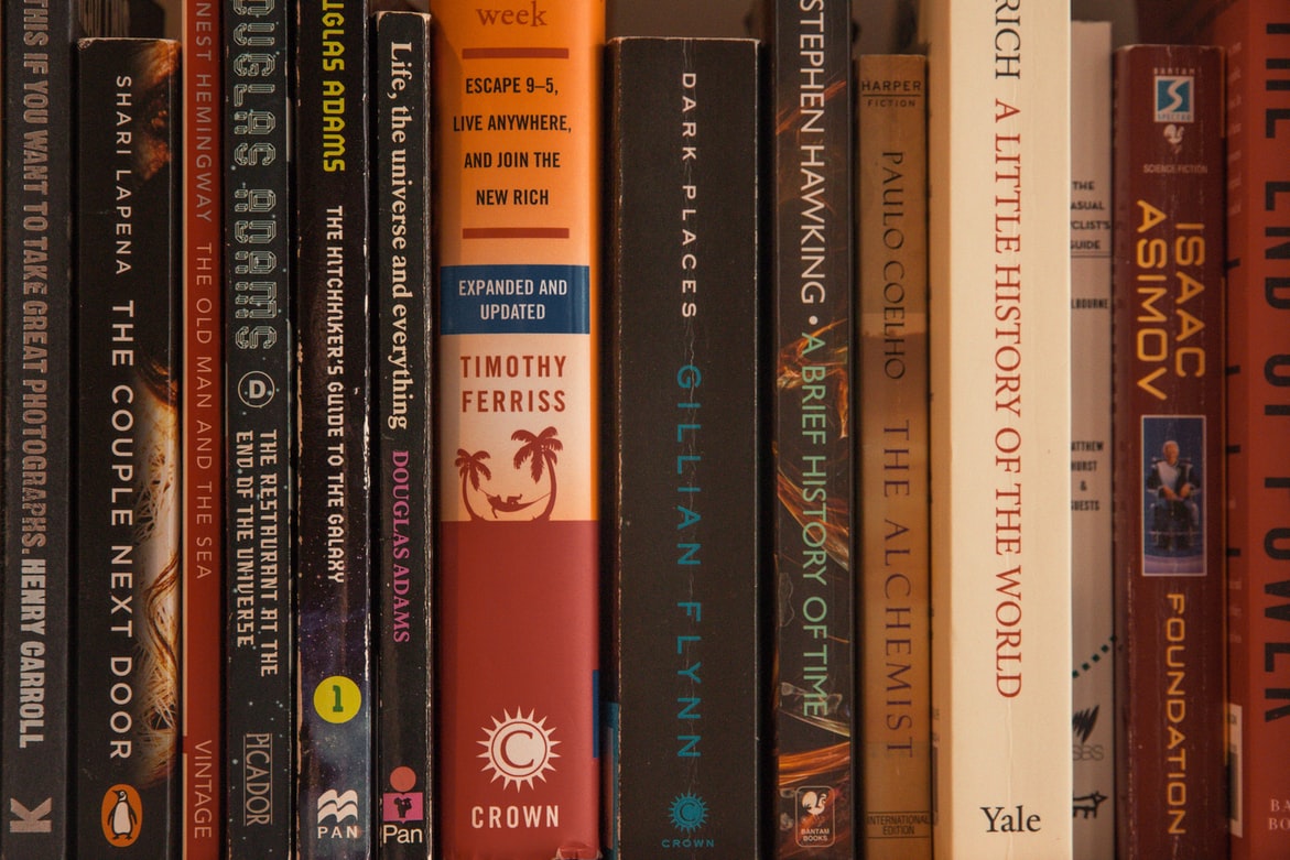 Non-Fiction Authors, A collection of books on a shelf, StudySmarter