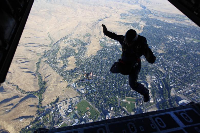 Uniformly Accelerated Motion Skydiver accelerating downwards due to gravity StudySmarter