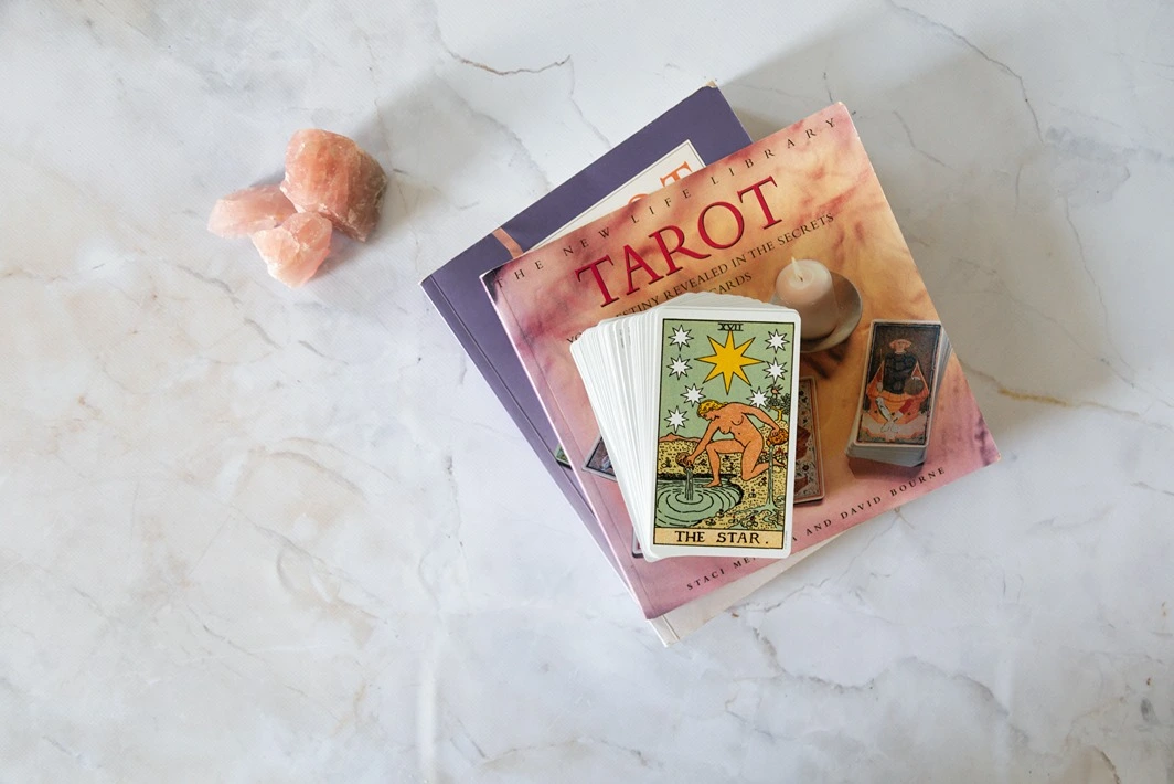 Secularisation UK, Image of tarot books and cards, StudySmarter