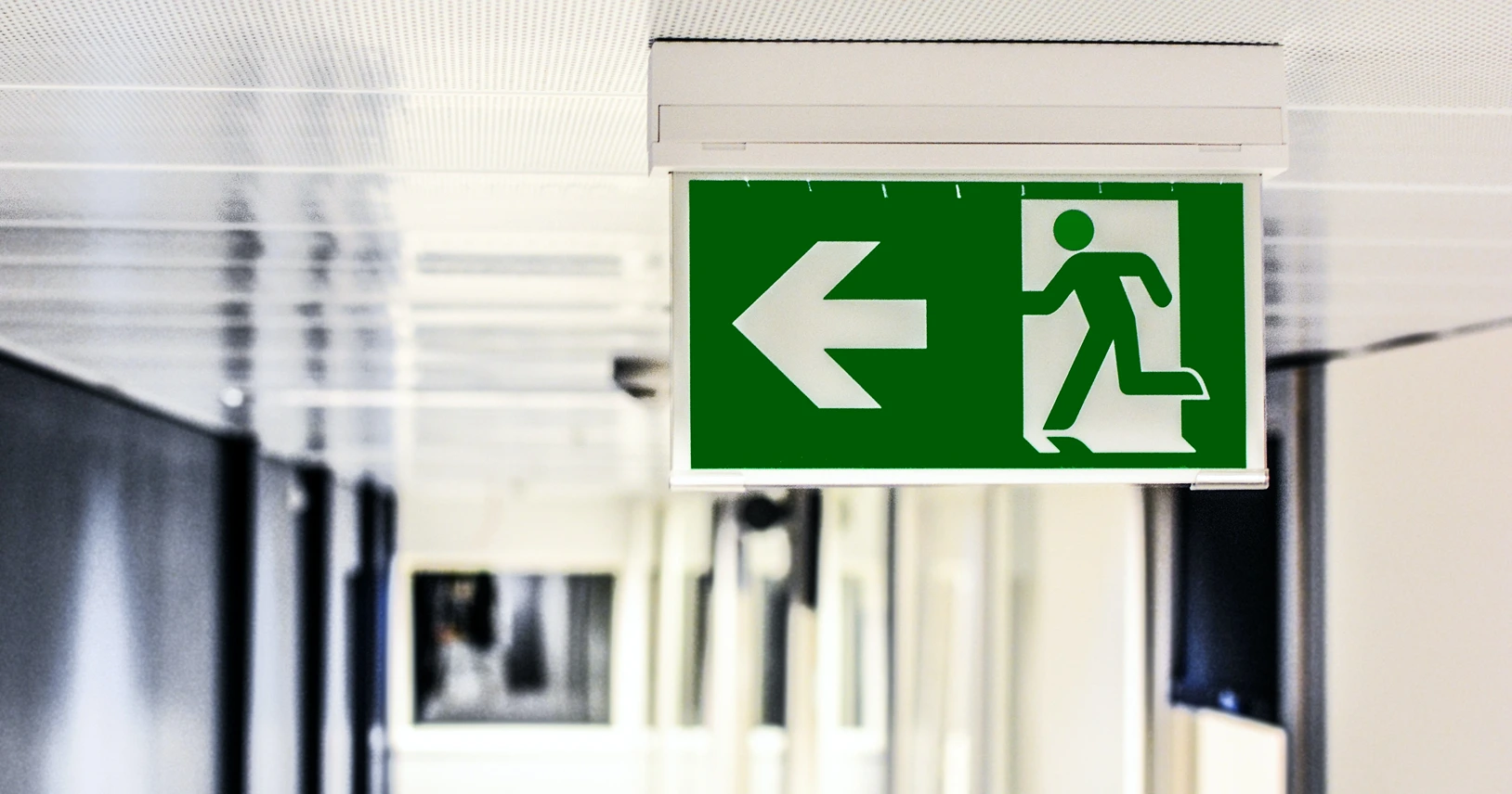 Semiotics, Image of an exit sign, StudySmarter