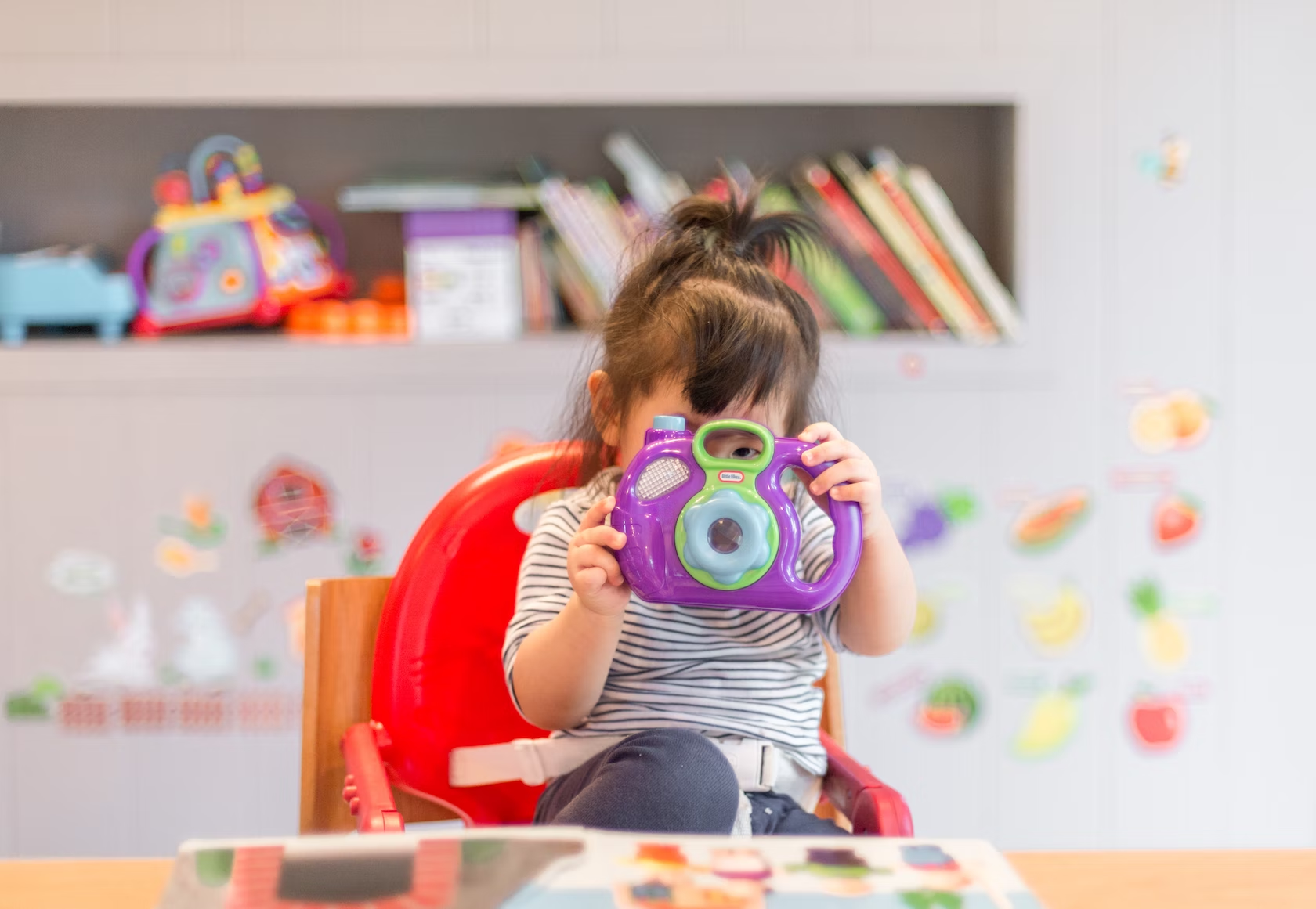 Demographic Change, little girl with toy, StudySmarter