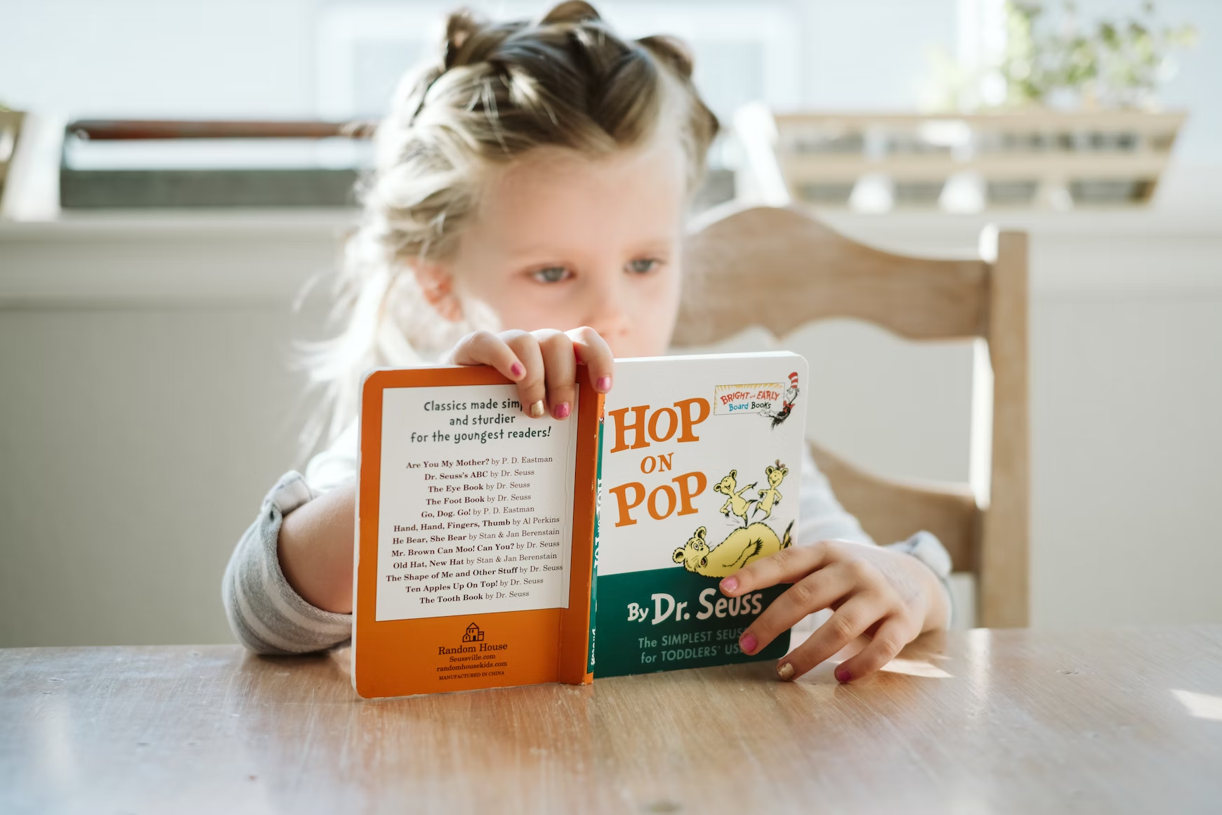 Demographic Change, little girl reading Dr. Seuss, StudySmarter