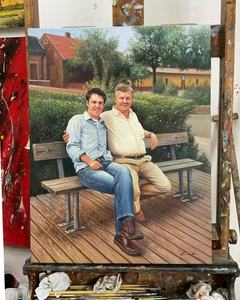 Pintura al óleo de un padre y un hijo sentados juntos