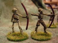 These are just basic undercoat - heavy drybrush - wash.

Naked skeletons are great for beginners because it's really easy to get them looking good, and they have a lots of good surface area to practice shading and highlighting basics on.