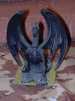 This is an old Grendel figure. It's very dusty, as you can see.