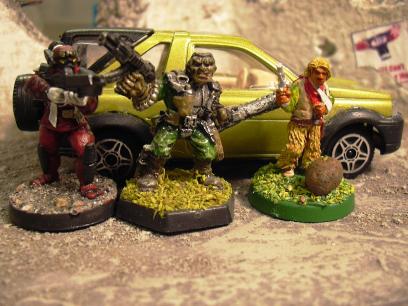 The dynamic trio in front of a Land Rover Freelander.