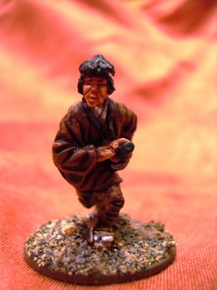 Another samurai. This is not 100% kosher 3-color one, though. The brown cloth is based on a Vallejo color and inkwashed before painting in the highlight. I simply squirted too much Vallejo brown and had to use it somewhere...