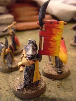 I couldn't find a transfer I liked for the banners and shields, and knowing that I suck at freehand, I painted this abstract flame motif instead.