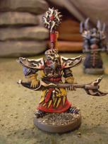 Here's the Big Mean Elf himself. I dropped the blue from the concept art and did him entirely in red/yellow/gold/black scheme.