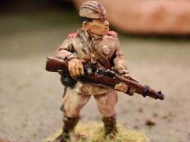 Old skool Black Tree Russian I did years ago. This is the way I used to do basically every mini. Each color is washed and highlighted separately, the eyes and other small details are done even if not in too great detail. This level of detail takes me about an hour per figure done on batches of about 10 minis. The brown boots are probably incorrect, but there was huge variation in Russian equipment anyways and they could be civilian items.
